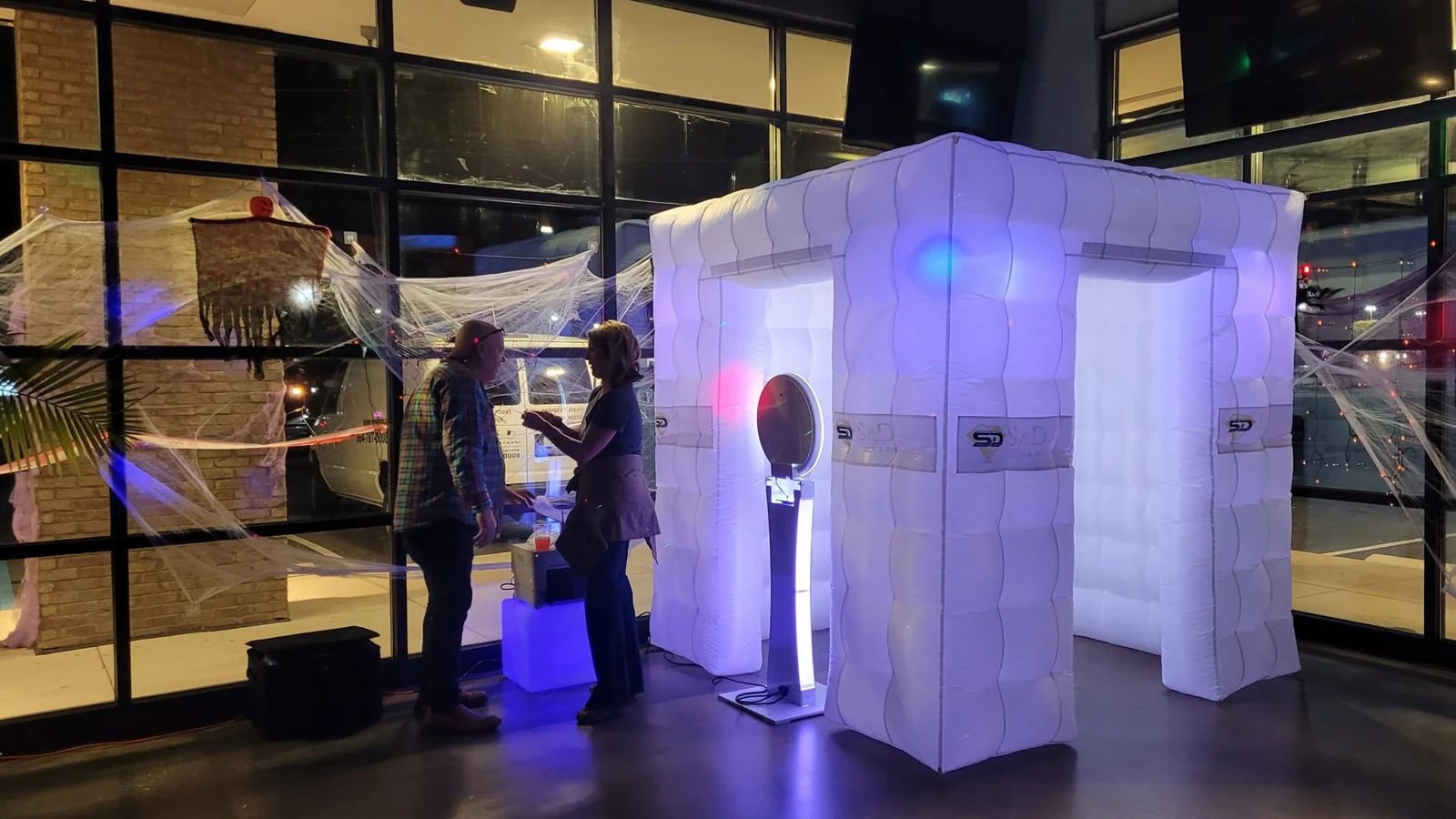 S and D illuminated inflatable photo booth at an event